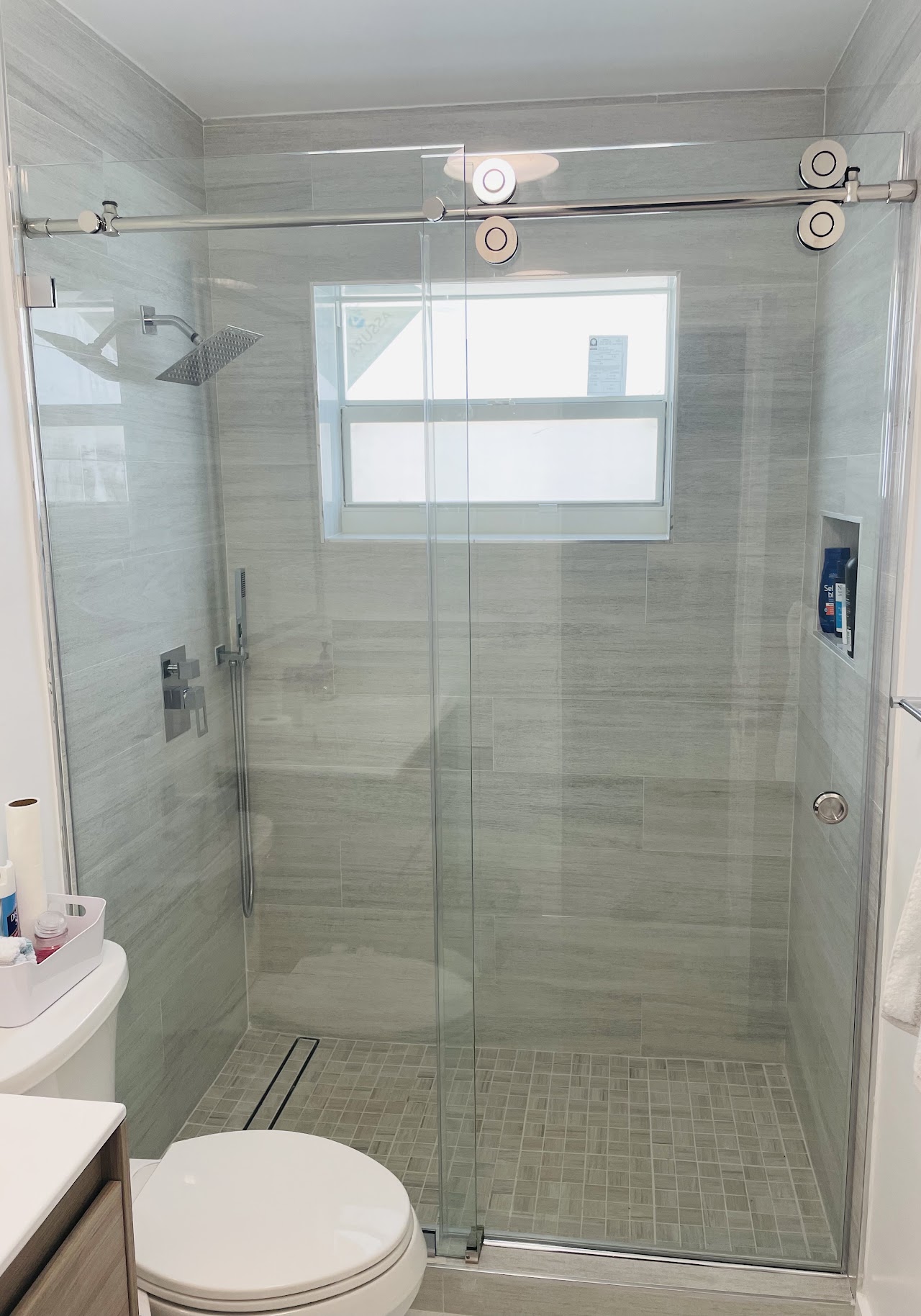 Shower glass with chrome fixtures