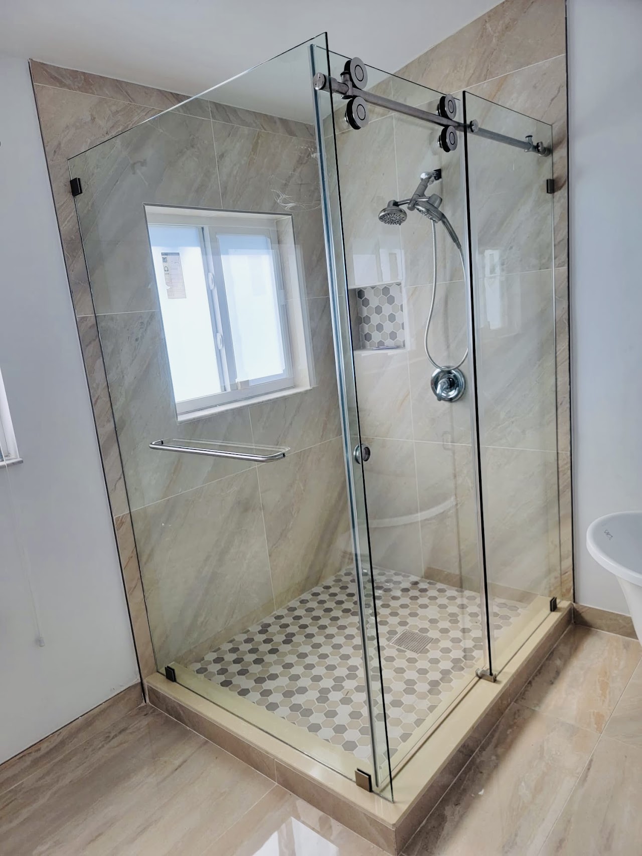 Corner shower enclosure with chrome hardware