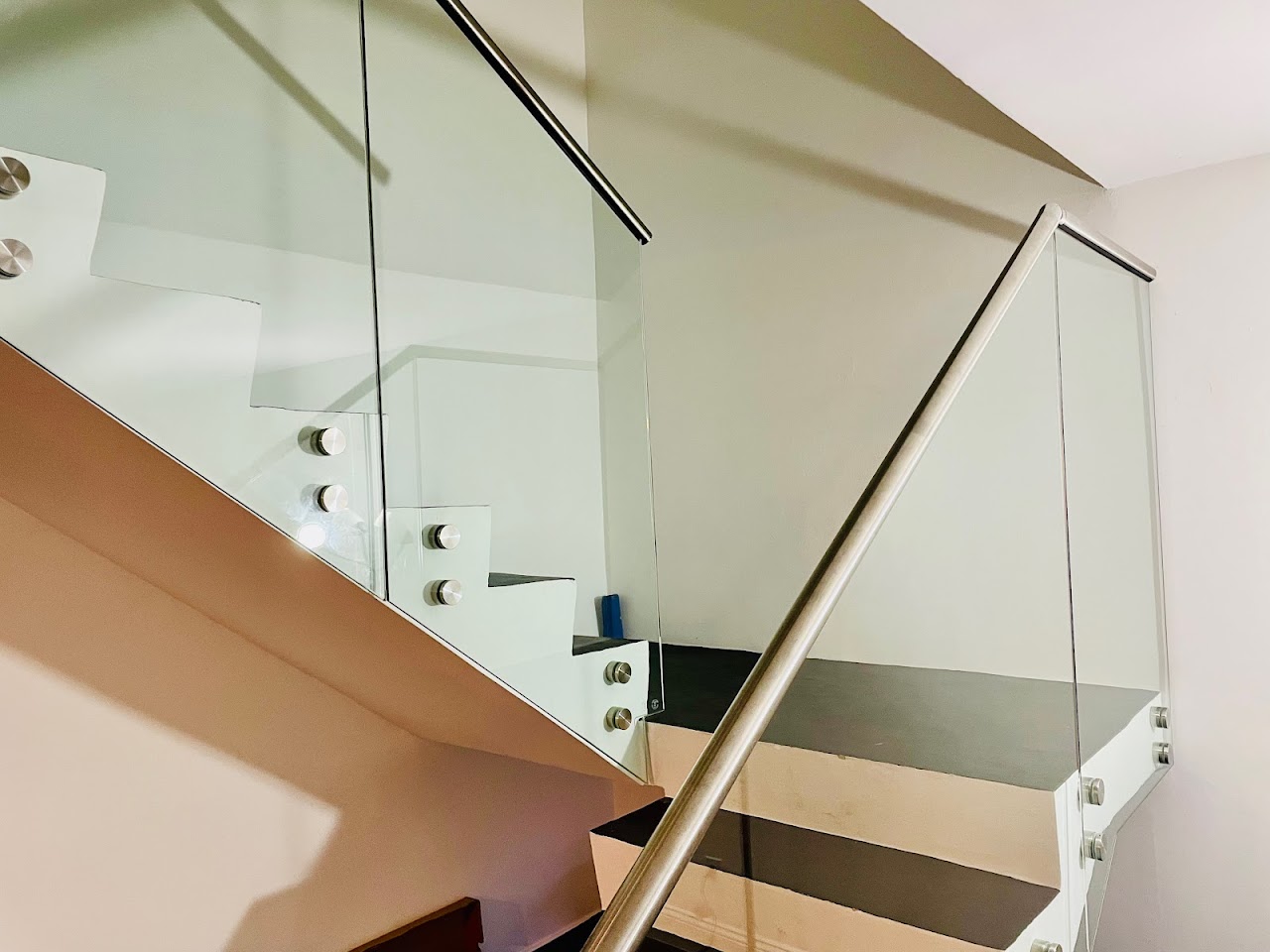 Glass stair railing in a modern interior