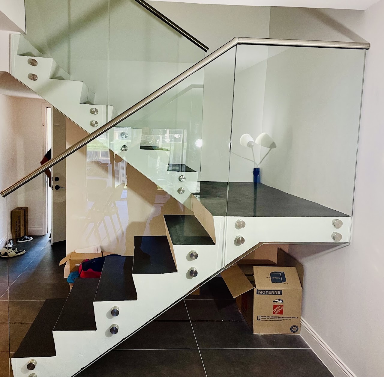 Glass railing with stainless steel handrail