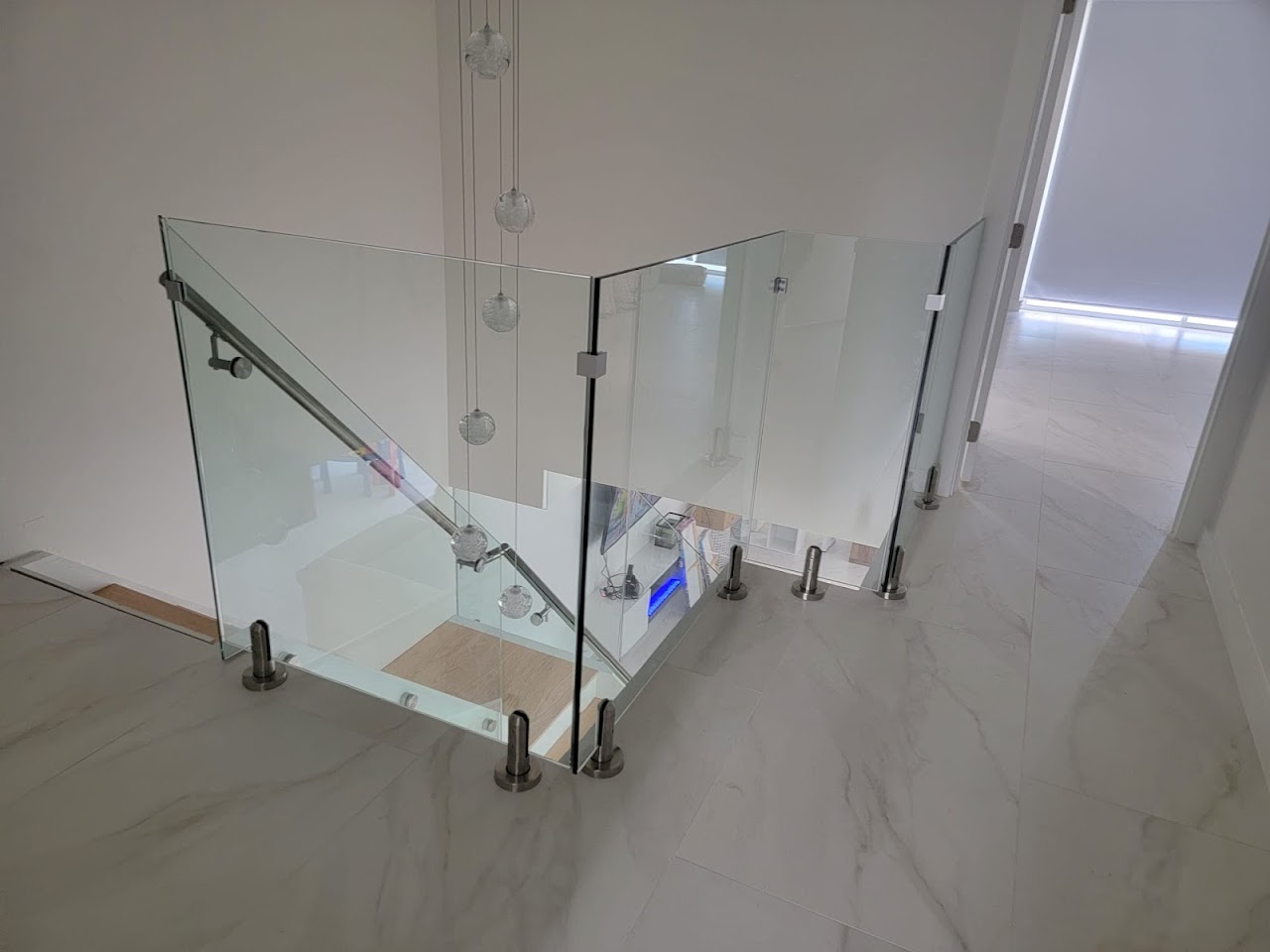 Glass stair railing viewed from above
